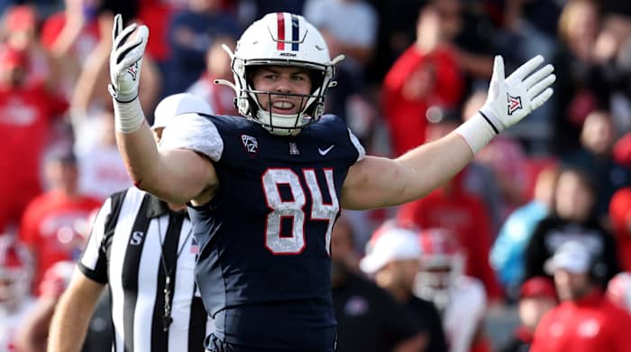 Arizona tight end Tanner McLachlan holds his hands out to celebrate a touchdown
